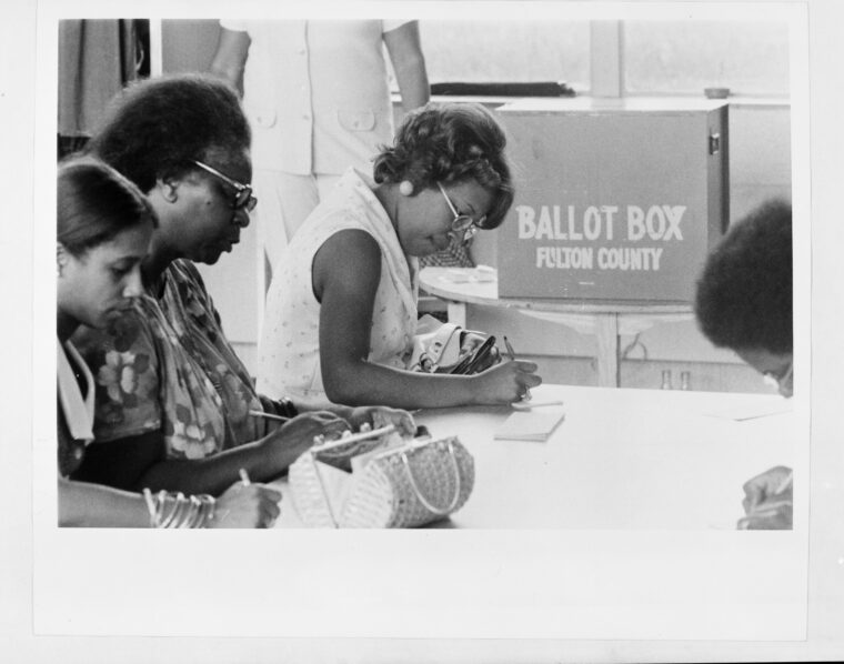 Four women fill out ballots at a Fulton County voting center. Voter Education Project Organizational Records, Atlanta University Center, Robert W. Woodruff Library.